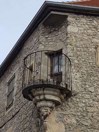 Low angle view of old building against sky