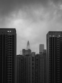 Modern buildings in city against sky