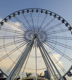 Low angle view of ferris wheel against sky