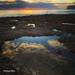 Scenic view of sea at sunset