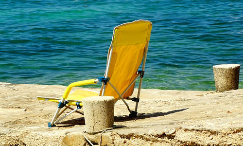 High angle view of chair on beach