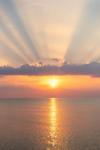 Scenic view of sea against romantic sky at sunset