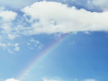 Low angle view of rainbow in sky