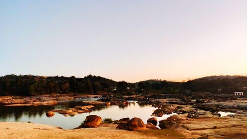 Panoramic view of lake against clear sky during sunset
