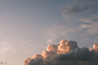 Sketchy  orange clouds glowing with the sun's rays