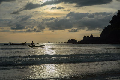 Scenic view of sea against cloudy sky