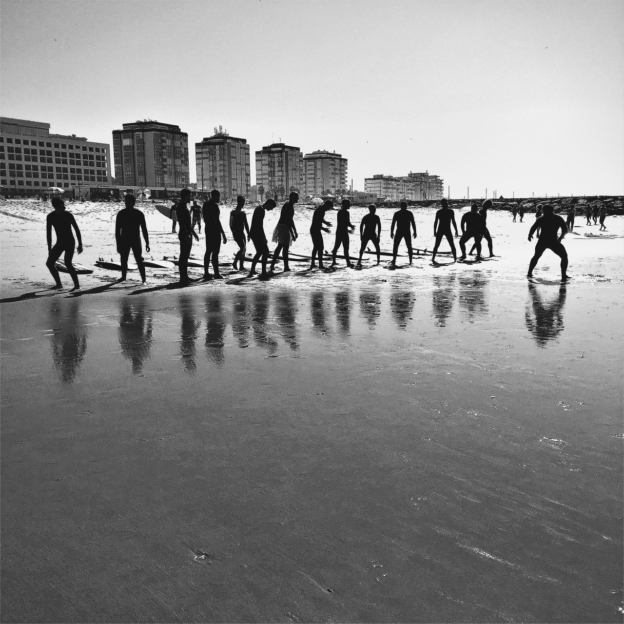 TOURISTS WALKING ON BEACH