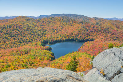 Scenic view of lake against mountain during autumn