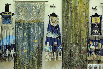 Close-up of clothes hanging on wooden post