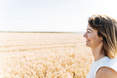 Summer concept, caucasian middle-aged woman in the countryside