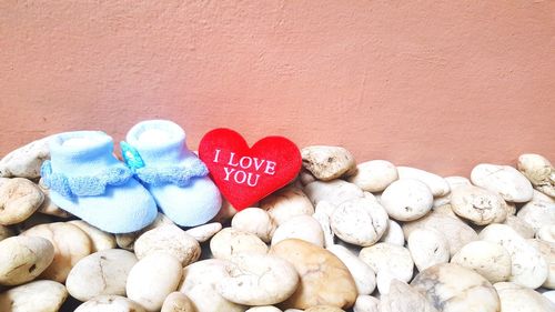 High angle view of heart shape on pebbles