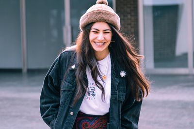Happy young woman wearing jacket