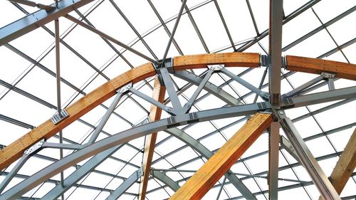 Low angle view of metallic structure against sky