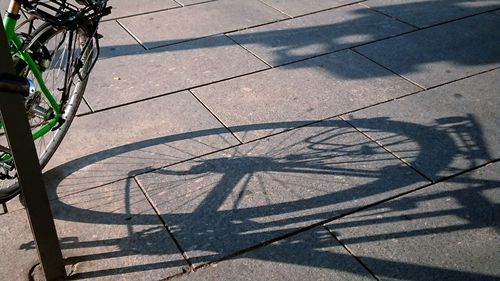 High angle view of bicycle on footpath