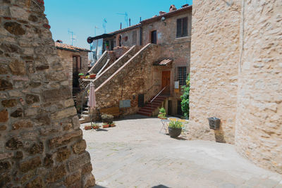 Narrow alley amidst buildings in town