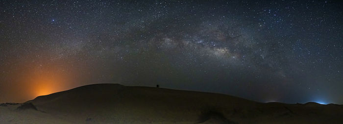 Low angle view of mountain against sky at night