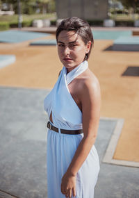 Portrait of young woman standing outdoor