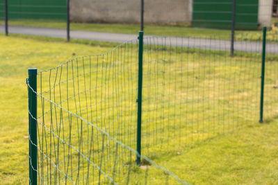 Soccer field seen through fence
