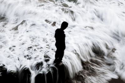 Woman standing in water