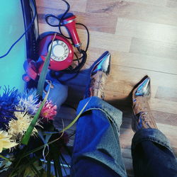 Low section of man wearing shoes on floor