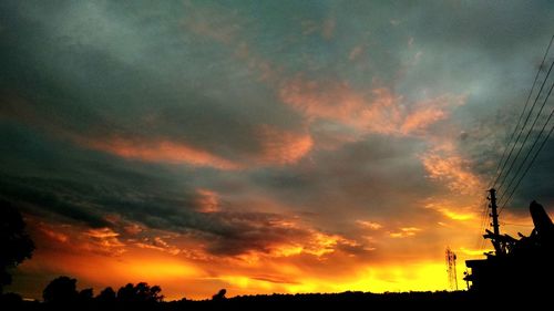 Low angle view of dramatic sky during sunset