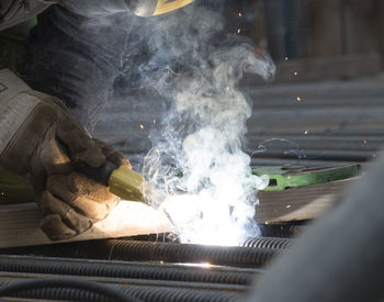 Close-up of man welding metal