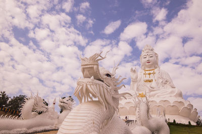 Low angle view of statue against sky