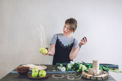 Woman eating food on table