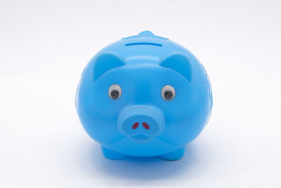 Close-up of blue toy over white background