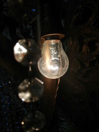 Close-up of illuminated light bulb