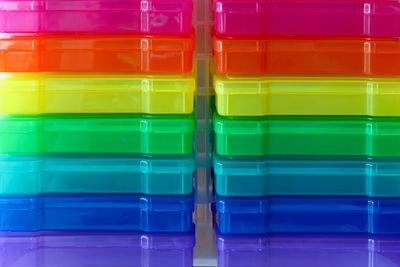 Close-up of colorful plastic containers for sale