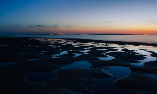 View of beach at sunset