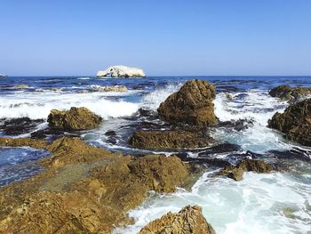 Scenic view of sea against clear sky