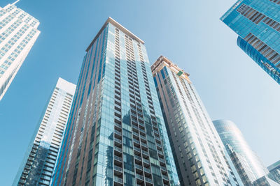 Low angle view of modern buildings against clear sky