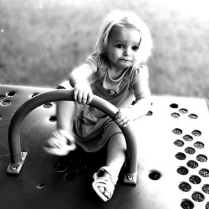 Cute girl playing with arms raised