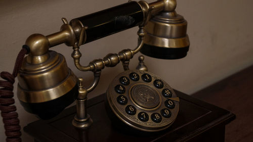 Close-up of telephone on table