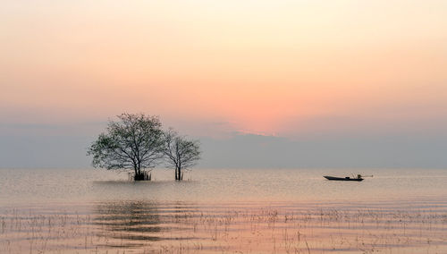 Scenic view of sea against sky at sunset