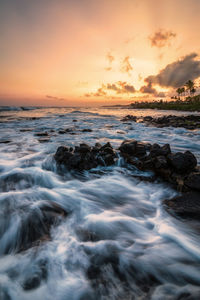 Scenic view of sea against sky during sunset