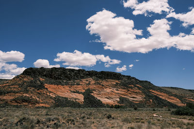 Low angle view of rocky mountain against sky