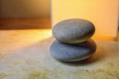 Close-up of pebbles on table