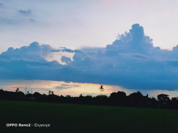 Scenic view of field against sky during sunset