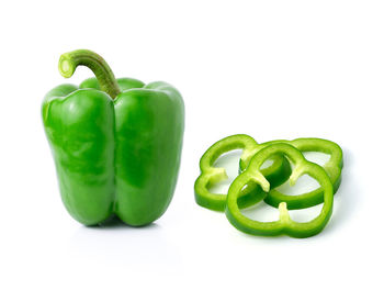 Close-up of green bell pepper against white background