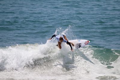 People splashing water in sea