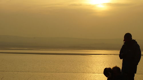 Scenic view of sea against sky at sunset