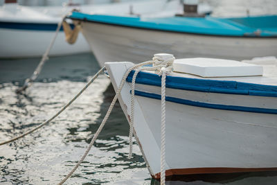 Boats moored at harbor