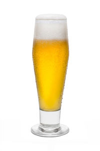 Close-up of beer glass against white background