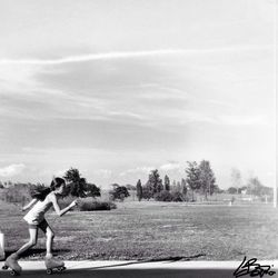 Full length of woman standing against sky