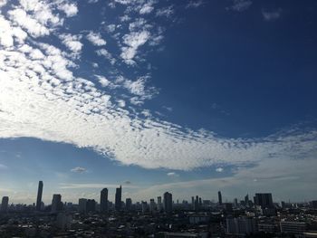 Buildings in city against sky