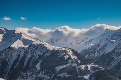 Scenic view of snowcapped mountains against sky