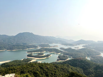 High angle view of townscape by sea against sky